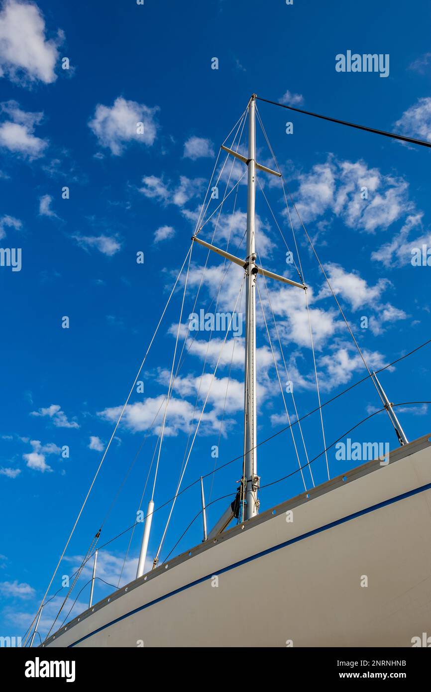 Partial view of small boat rigging with beautiful sunny sky in the ...