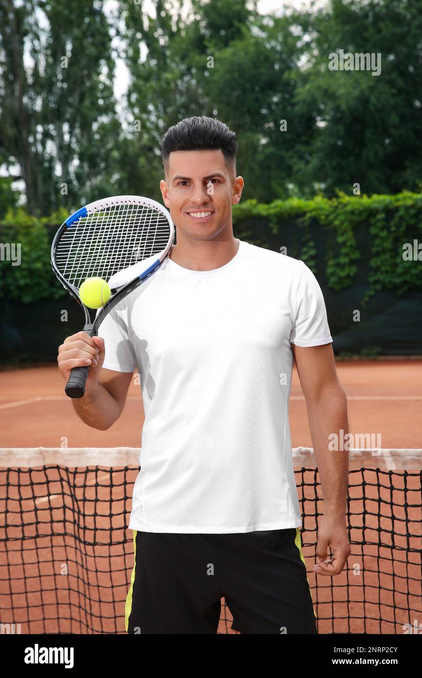 Man Using Tennis Racket Man with racket and ball on tennis court Stock Photo - Alamy