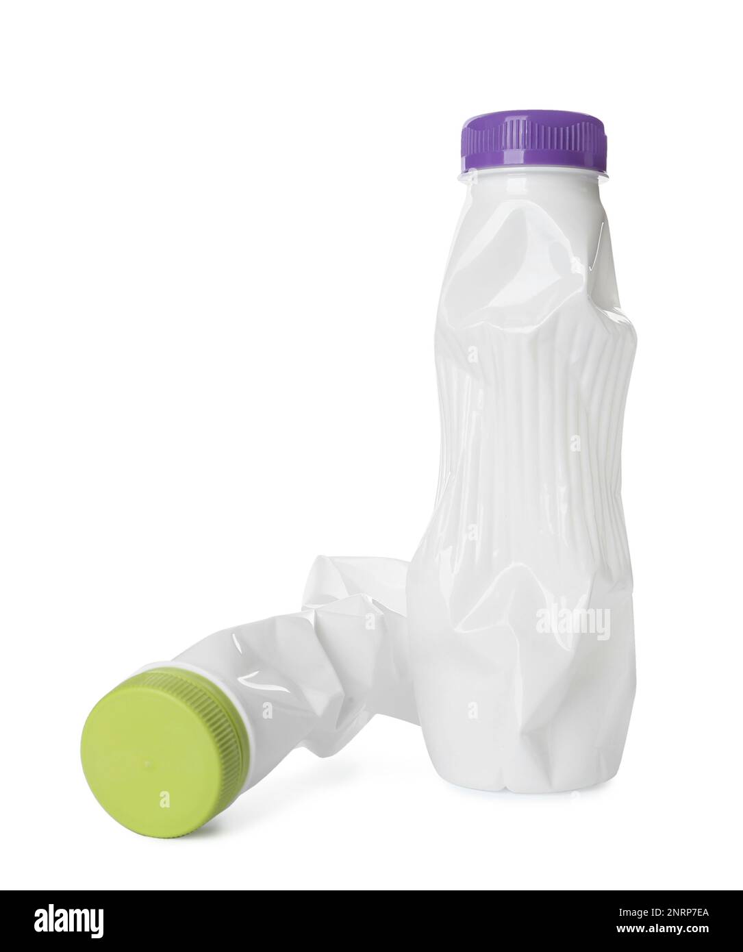 Crumpled disposable plastic bottles on white background Stock Photo - Alamy