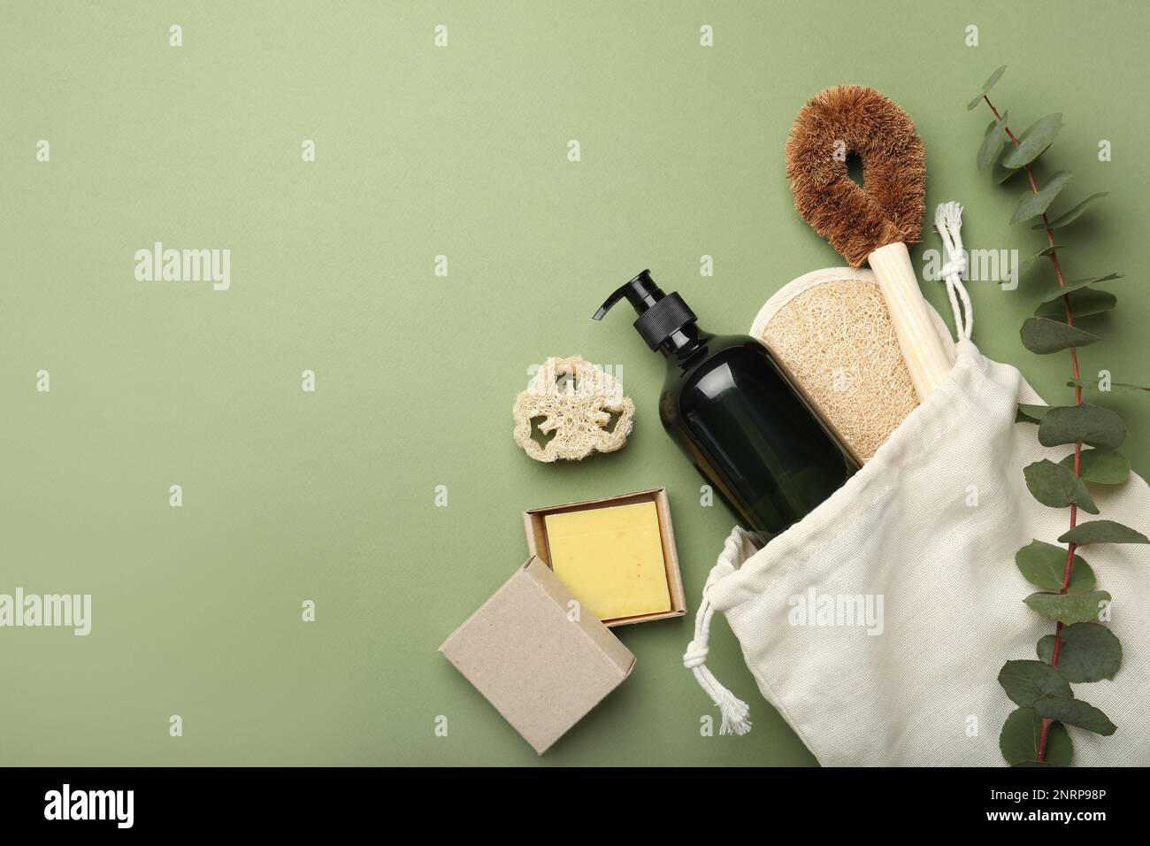 Flat lay composition with eco friendly products on green background ...