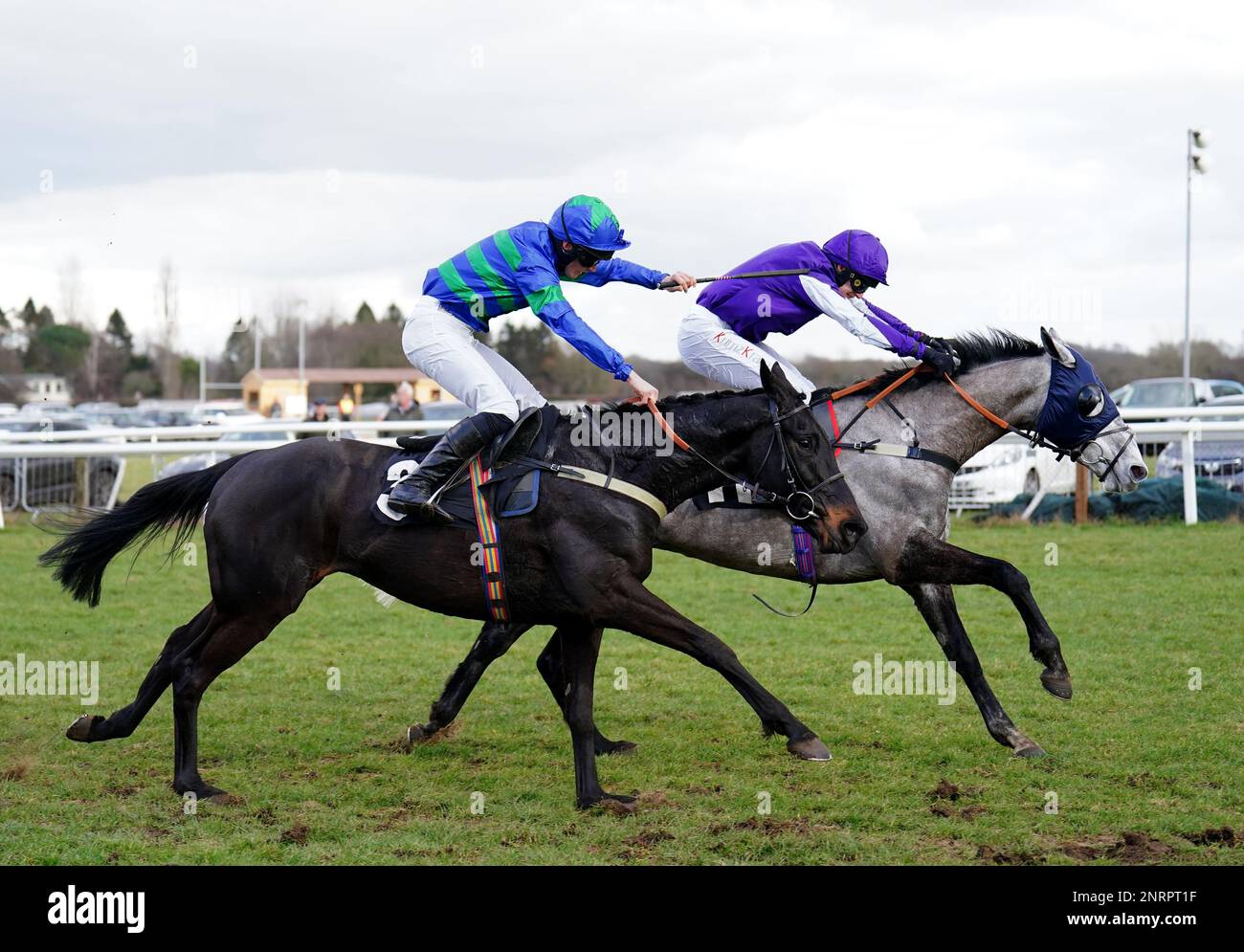 Hilnamix ridden by David Bass (right) passes One For The Wall ridden by Freddie Gordon on their way to winning the Coral Racing Club Handicap Hurdle at Plumpton Racecourse, East Sussex. Picture date: Monday February 27, 2023. Stock Photo