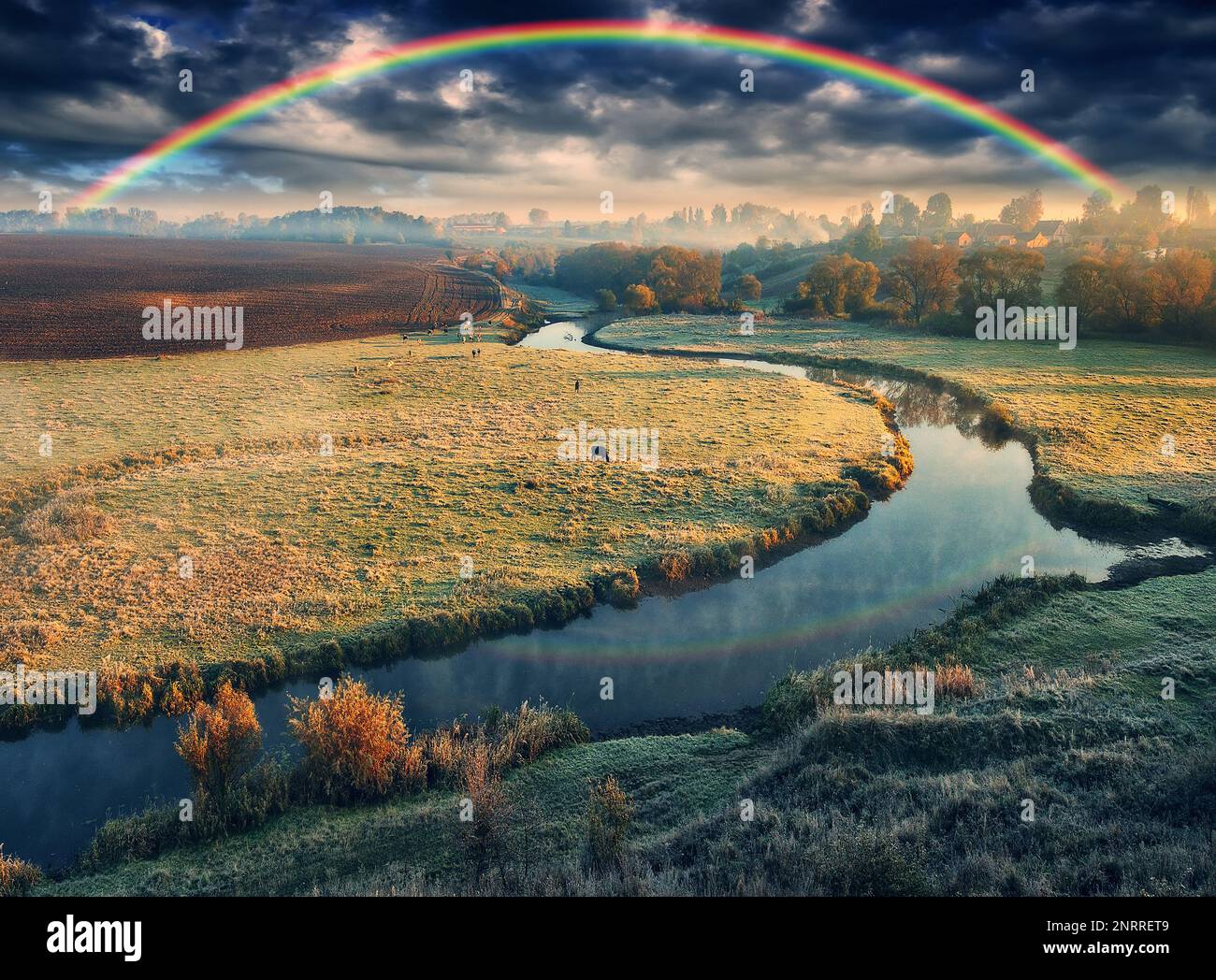 Amazing rainbow over the small rural river. autumn morning. nature of Ukraine Stock Photo
