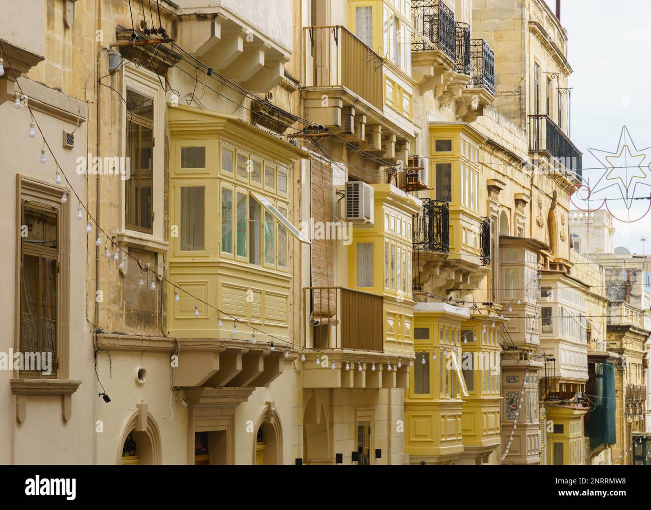 Colorful traditional maltese balconies yellow limestone townhouses