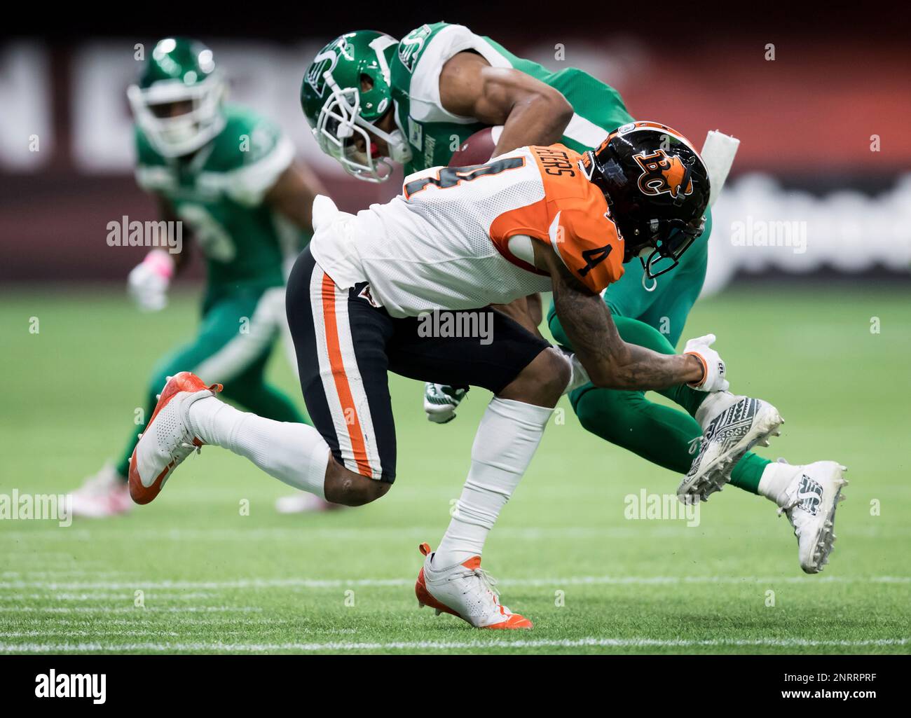 https://c8.alamy.com/comp/2NRRPRF/bc-lions-garry-peters-front-tackles-saskatchewan-roughriders-shaq-evans-during-the-first-half-of-a-canadian-football-league-game-friday-oct-18-2019-in-vancouver-british-columbia-darryl-dyckthe-canadian-press-via-ap-2NRRPRF.jpg