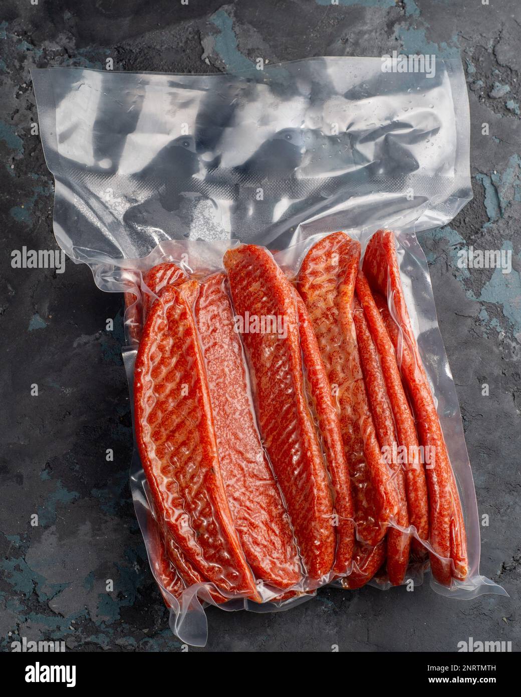 Salted dried fish sticks in a vacuum package. Snack for beer Stock Photo Alamy