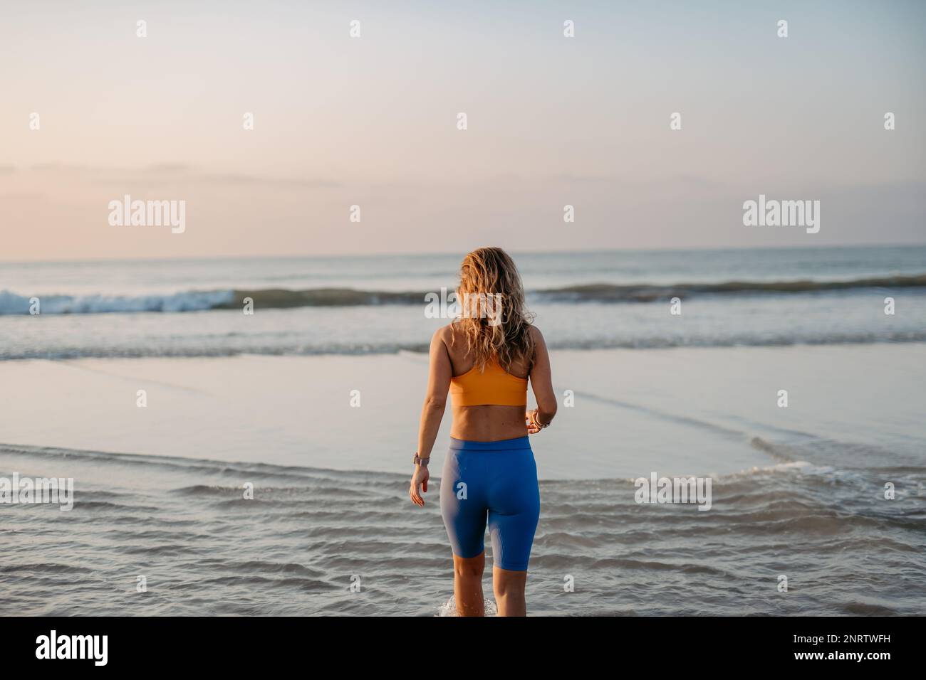 Back view woman jogging on hi-res stock photography and images - Alamy
