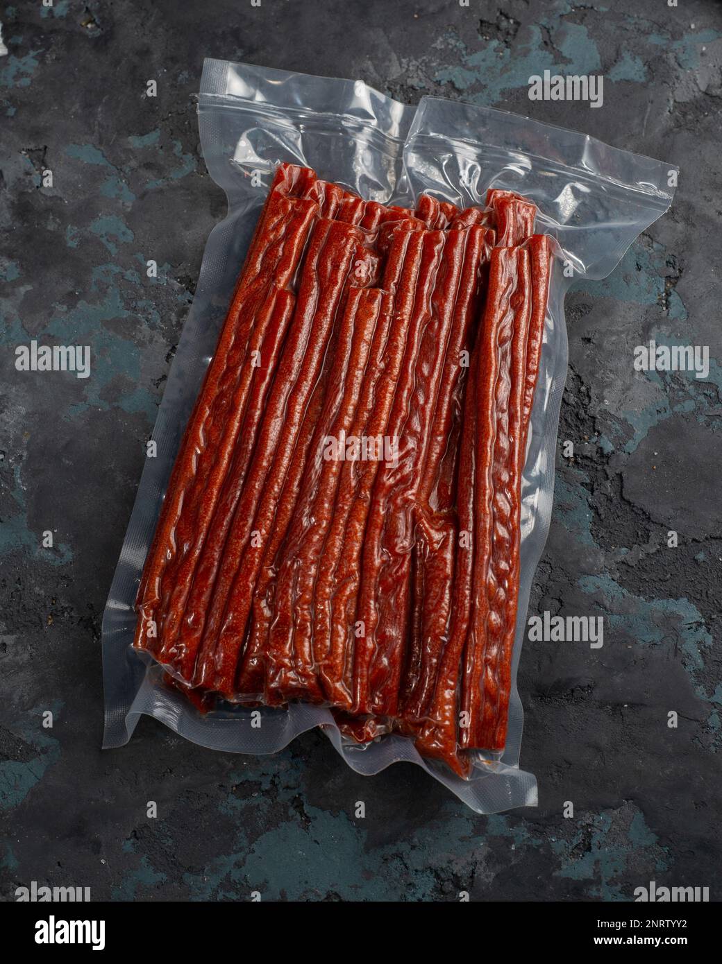 Salted dried fish sticks in a vacuum package. Snack for beer Stock Photo Alamy