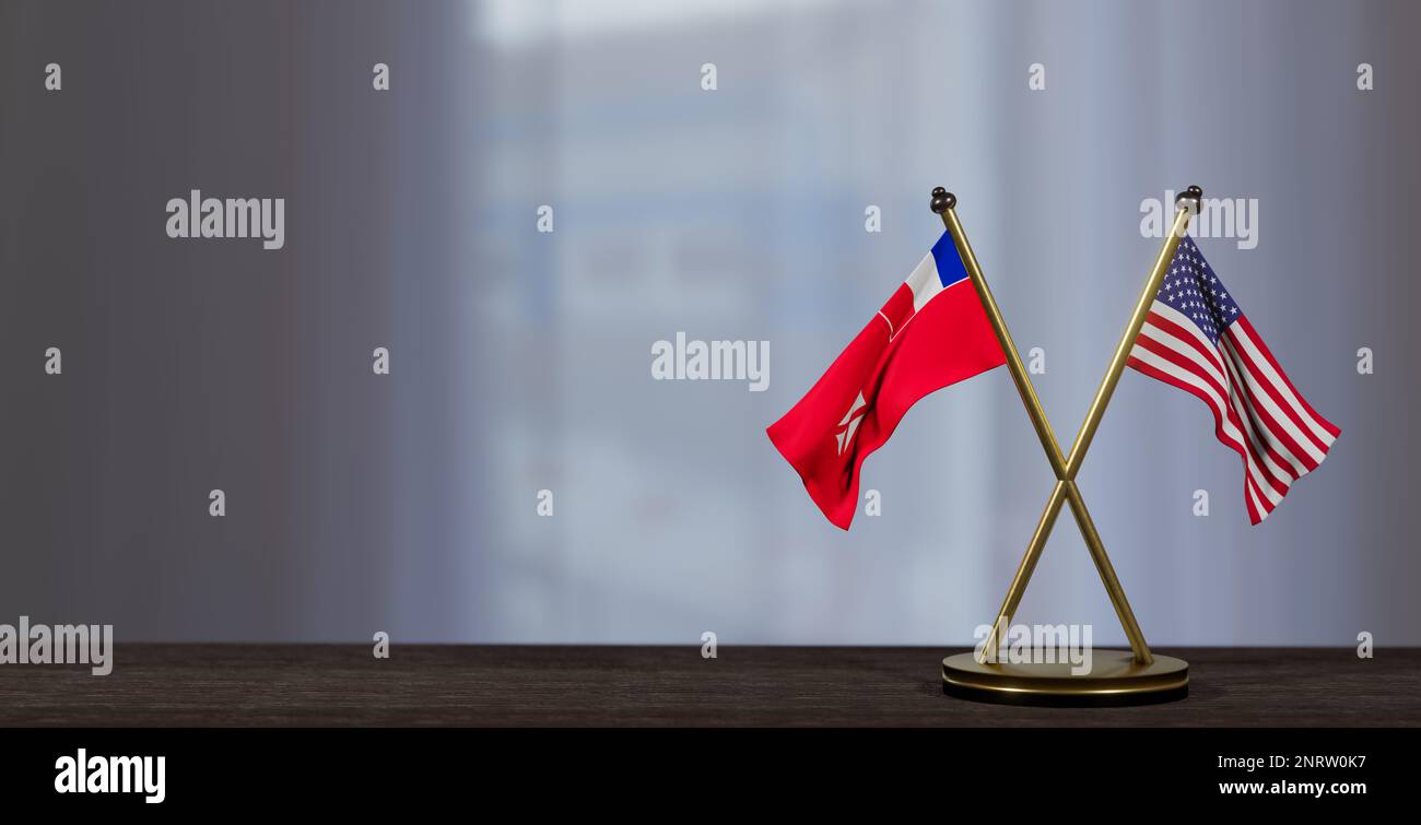 Wallis and Futuna and USA flags on table. Negotiation between Wallis and Futuna and United States. on little blur background. 3D work and 3D image Stock Photo