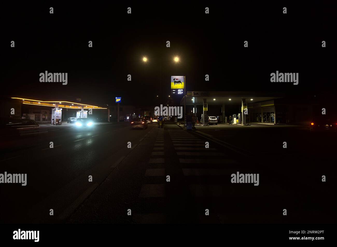 Gas  stations on a country road at night Stock Photo