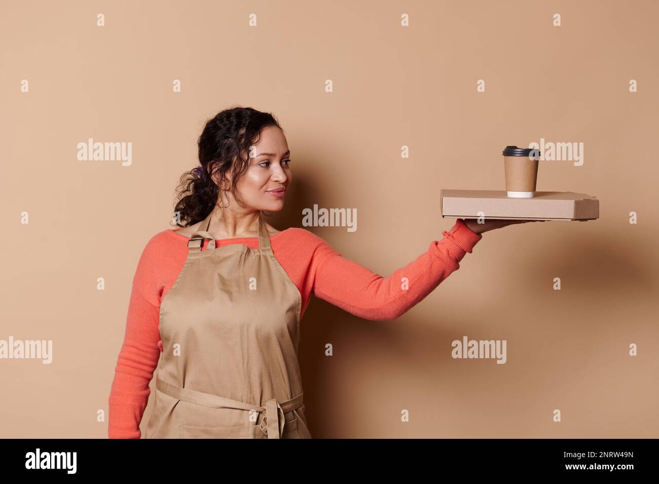 African American pretty waitress holding cardboard flat box with tasty  Italian pizza and takeaway hot drink in paper cup Stock Photo - Alamy