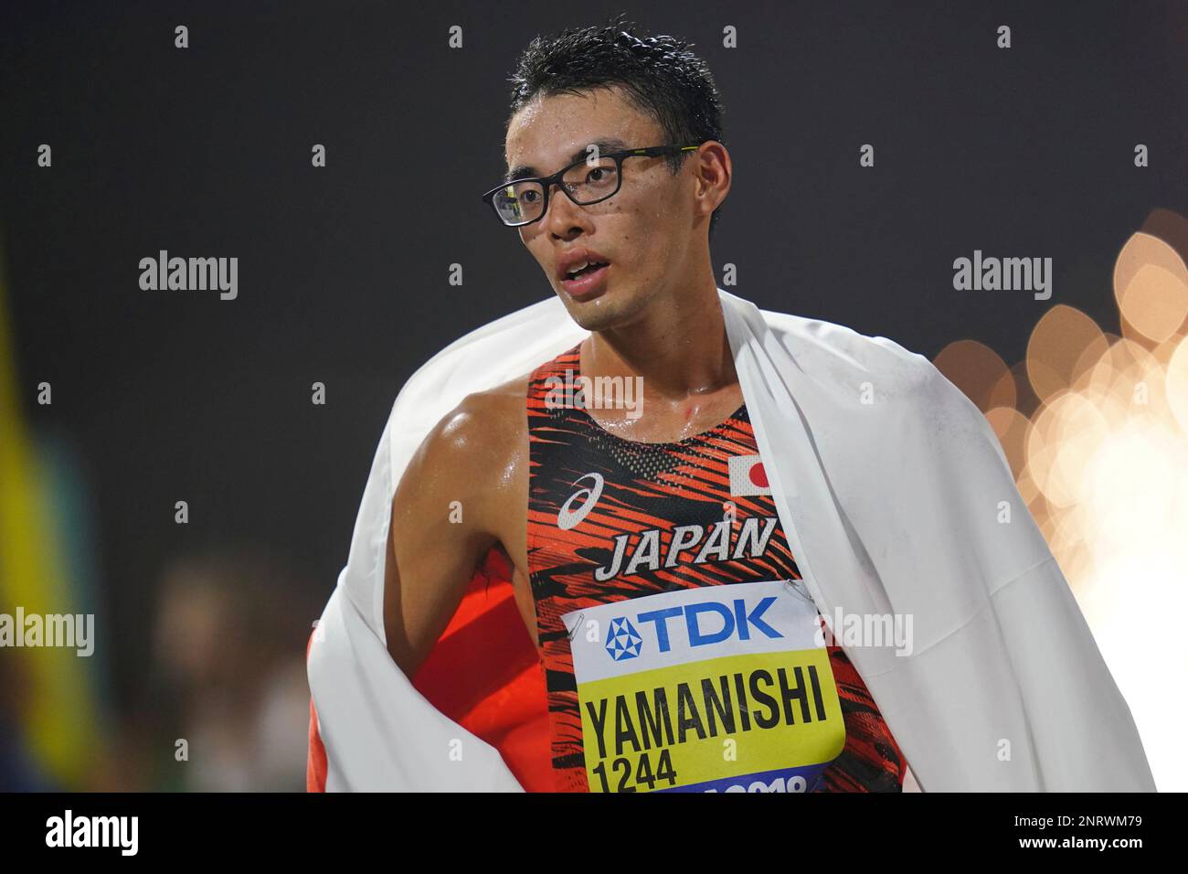 Japan's Toshikazu Yamanishi reacts after winning 20 Kilometres Race