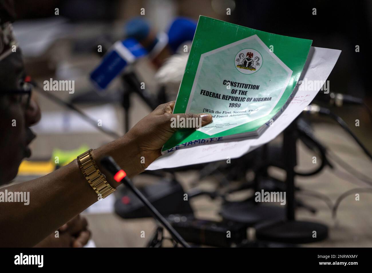 All Progressives Congress (APC) party official Festus Keyamo holds a copy  of the country's constitution while speaking about it at a press conference  in Abuja, Nigeria Monday, Feb. 27, 2023. Each of, image size:1300x956