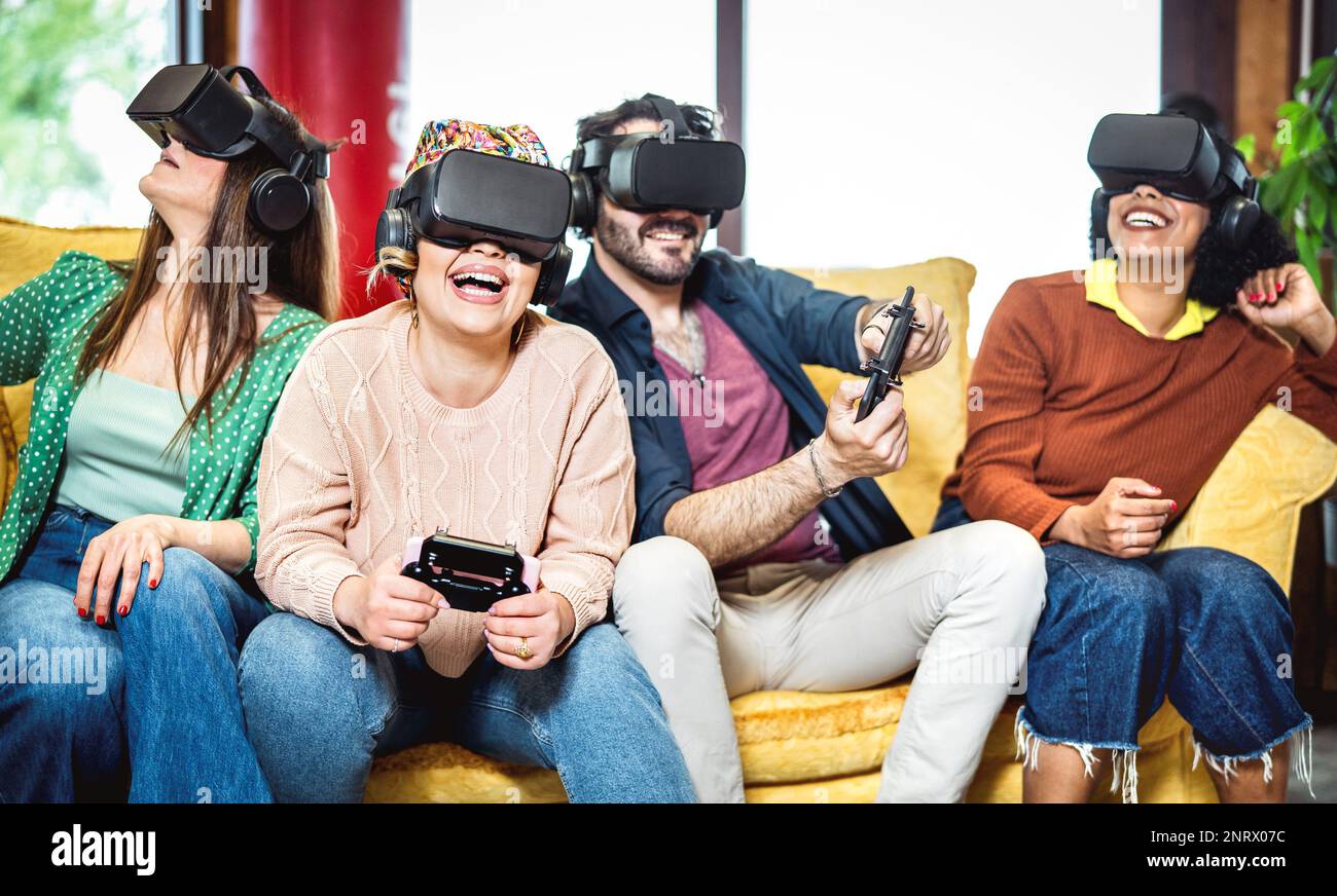 Trendy people playing with vr glasses on sofa Virtual reality and