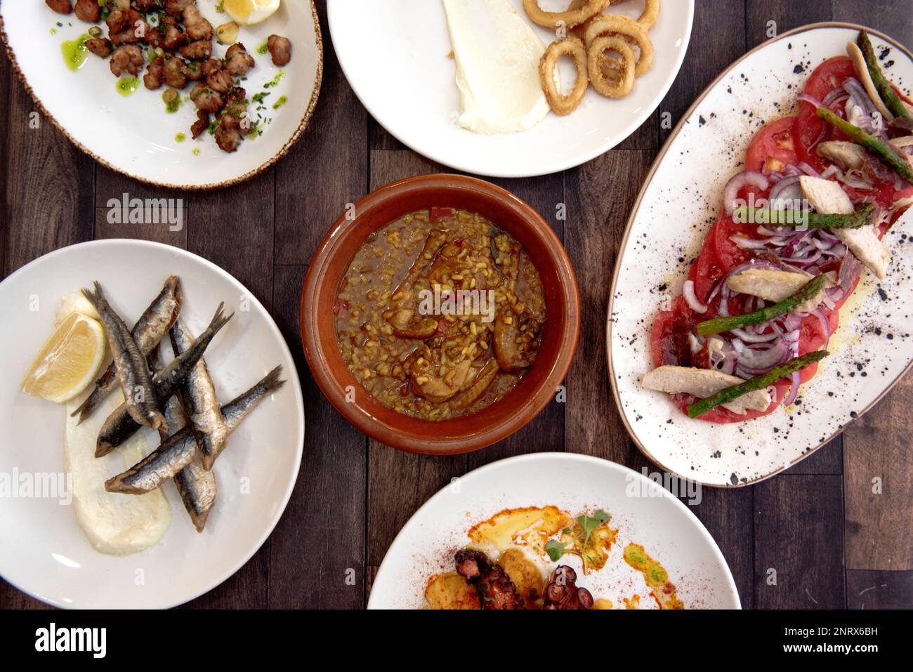 Spanish tapas recipes with fried anchovies, grilled octopus, sliced