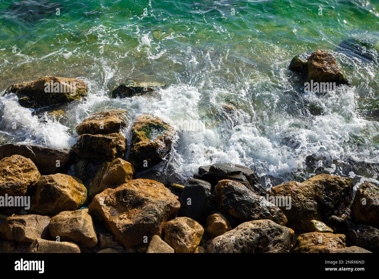 A top view of waves breaking between rocks, stone Stock Photo - Alamy