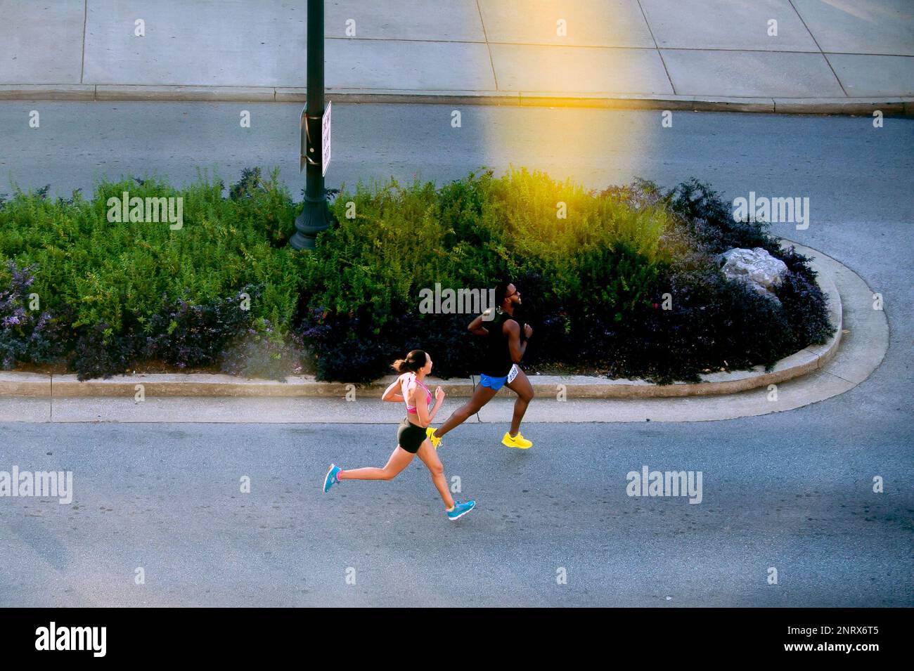 Harlan Holmes (right) and Bonita Paul run along Avenue of Champions Saturday, September 21, 2019, during the annual Med Center Health 10K Classic in Bowling Green, Ky. (Bac Totrong/Daily News via AP) Stock Photo