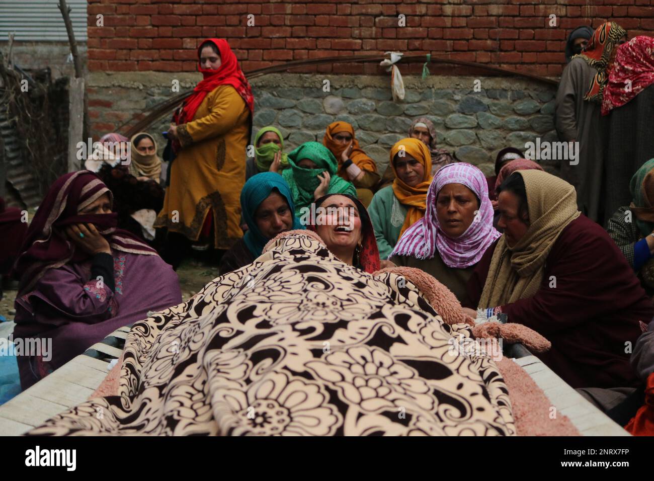 Non Exclusive: February 26,2023,Srinagar Kashmir,India: Kashmiri women look on as funeral ceremony of Sanjay Sharma is being held in Achan village of Stock Photo