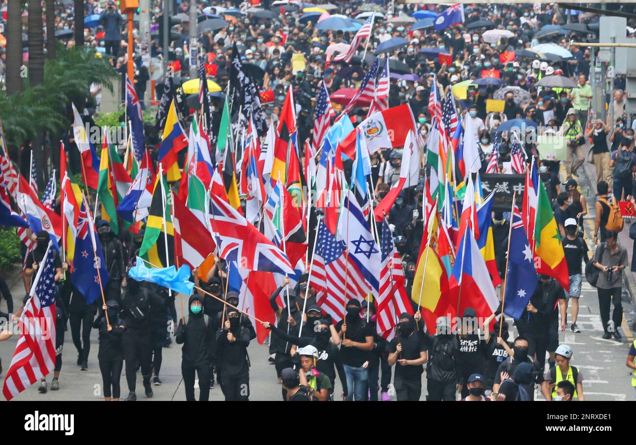 Protesters gather to lift up their voices with national flags of the ...