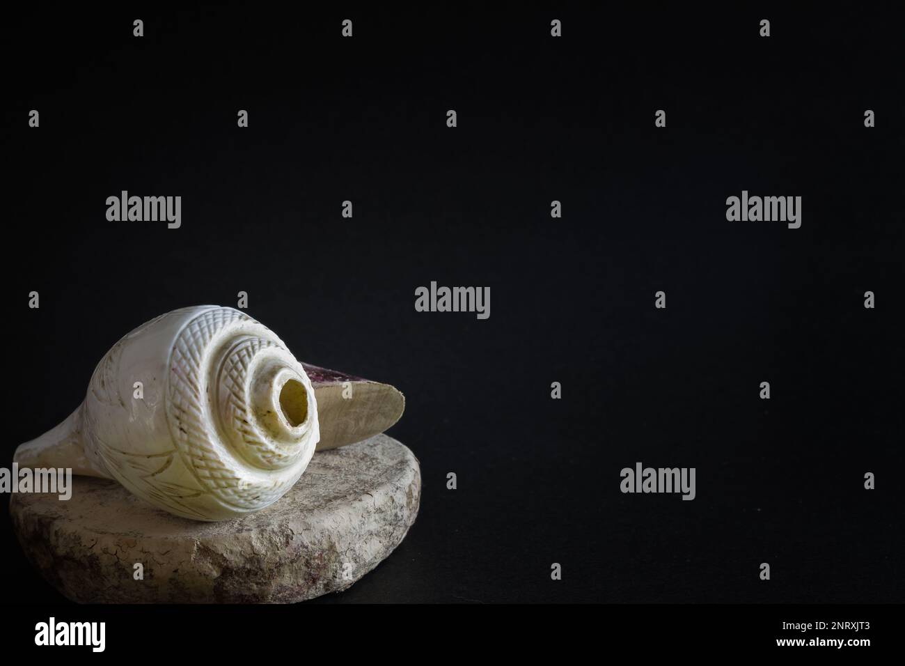 puja essentials conch shell with sandalwood stick and stone. symbolic ...