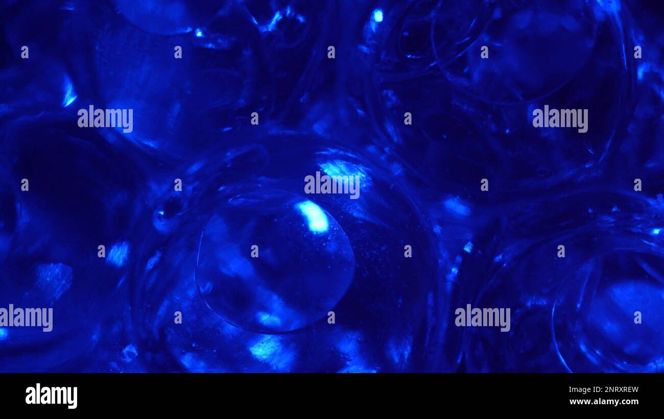 Water color gel balls. Super macro bubbles slow motion. Bubbles of