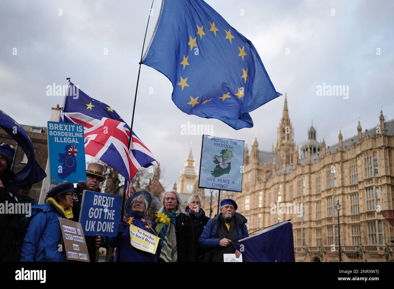 Anti-Brexit protester Steve Bray (second left top hat) on College Green, in Westminster, London, following the announcement that European Commission president Ursula von der Leyen and Prime Minister Rishi Sunak have struck a deal over the Northern Ireland Protocol. Picture date: Monday February 27, 2023. Stock Photo