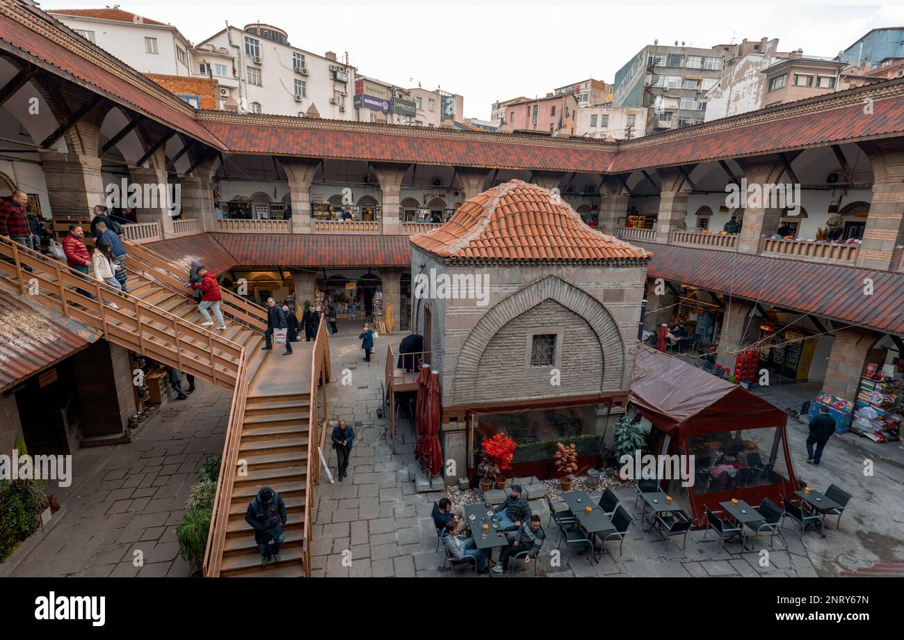 Ankara-Turkey: February 25, 2023: Local people and tourists shopping or sitting at cafe and talking in historical Suluhan caravansera. Stock Photo