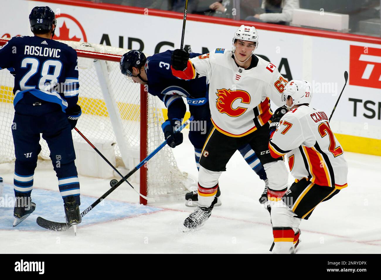Calgary Flames center Adam Ruzicka (63) goes after the puck under the  skates of Florida Panthers center Sam Reinhart (13) during the third period  of an NHL hockey game, Saturday, Nov. 19, 2022, in Sunrise, Fla. (AP  Photo/Marta Lavandier Stock Photo