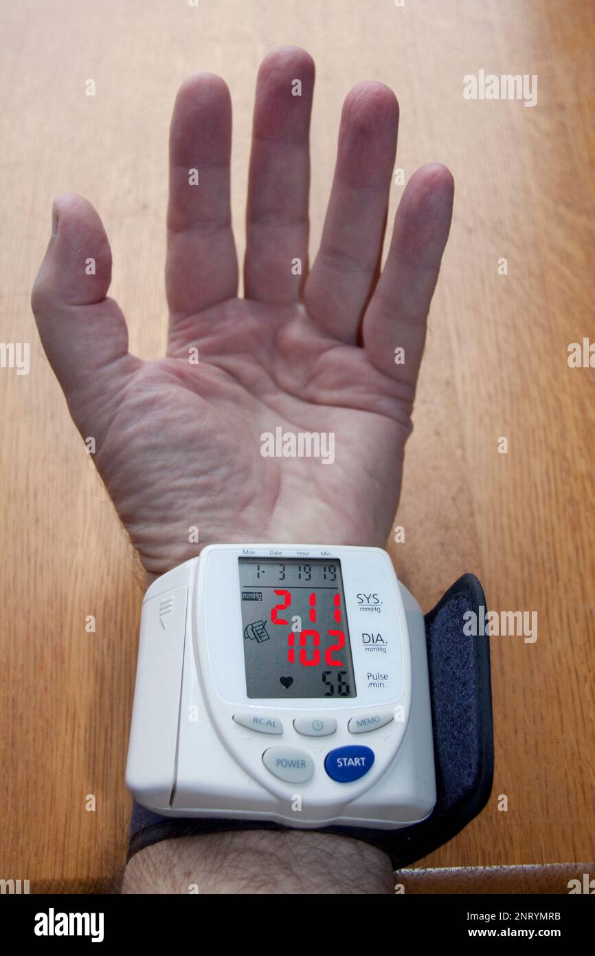Checking Blood pressure at home to high Stock Photo Alamy