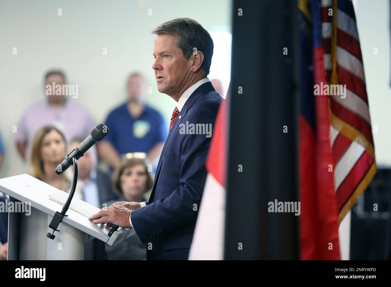 Governor Brian Kemp speaks at a meeting prior to a tour of GE