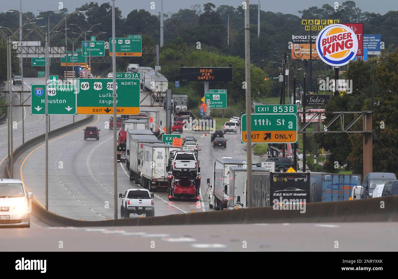 Tractor trailers park on the side of Interstate 10 Thursday after