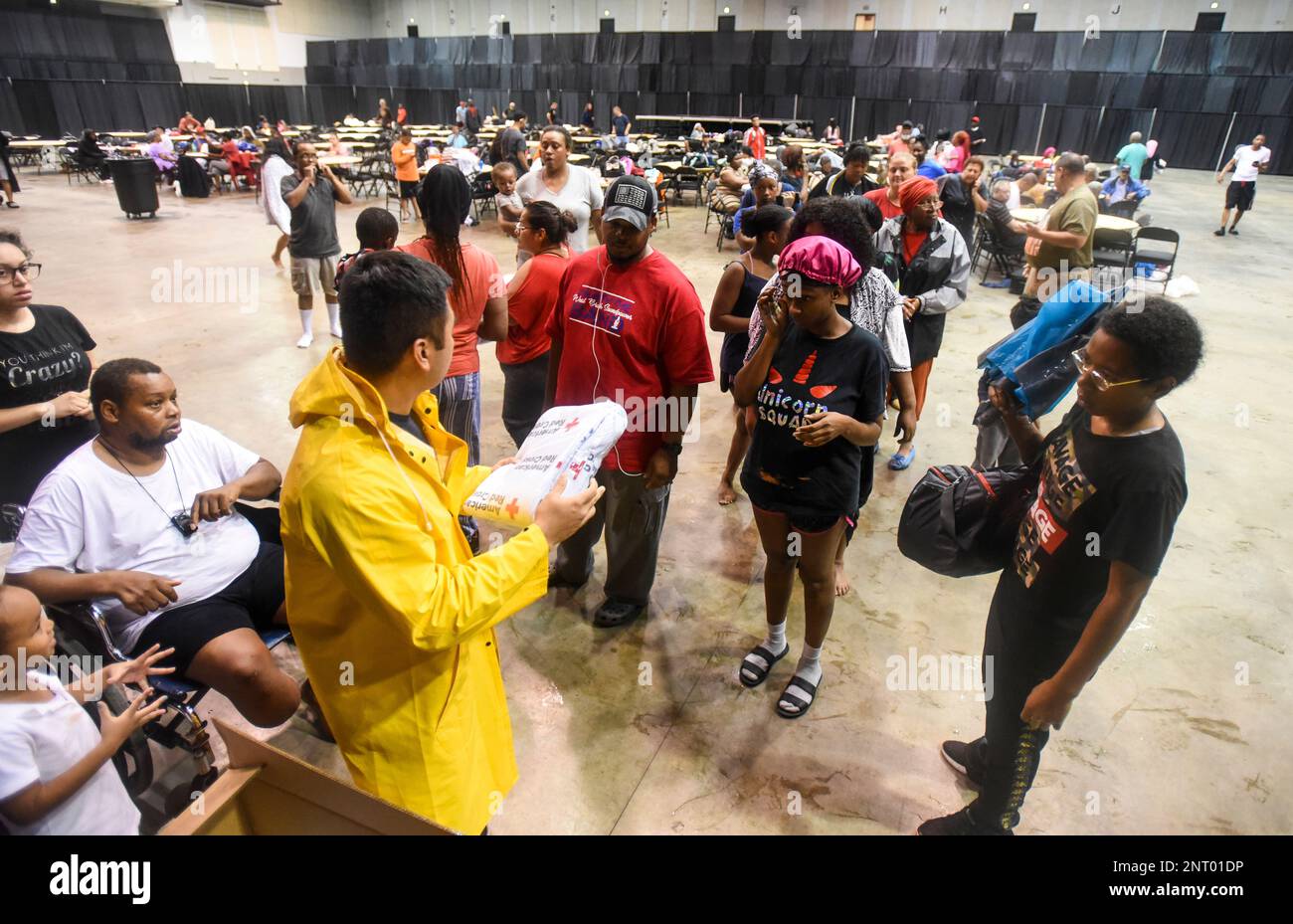 A Beaumont firefighter hands out blankets at the Beaumont Civic Center after the Center was