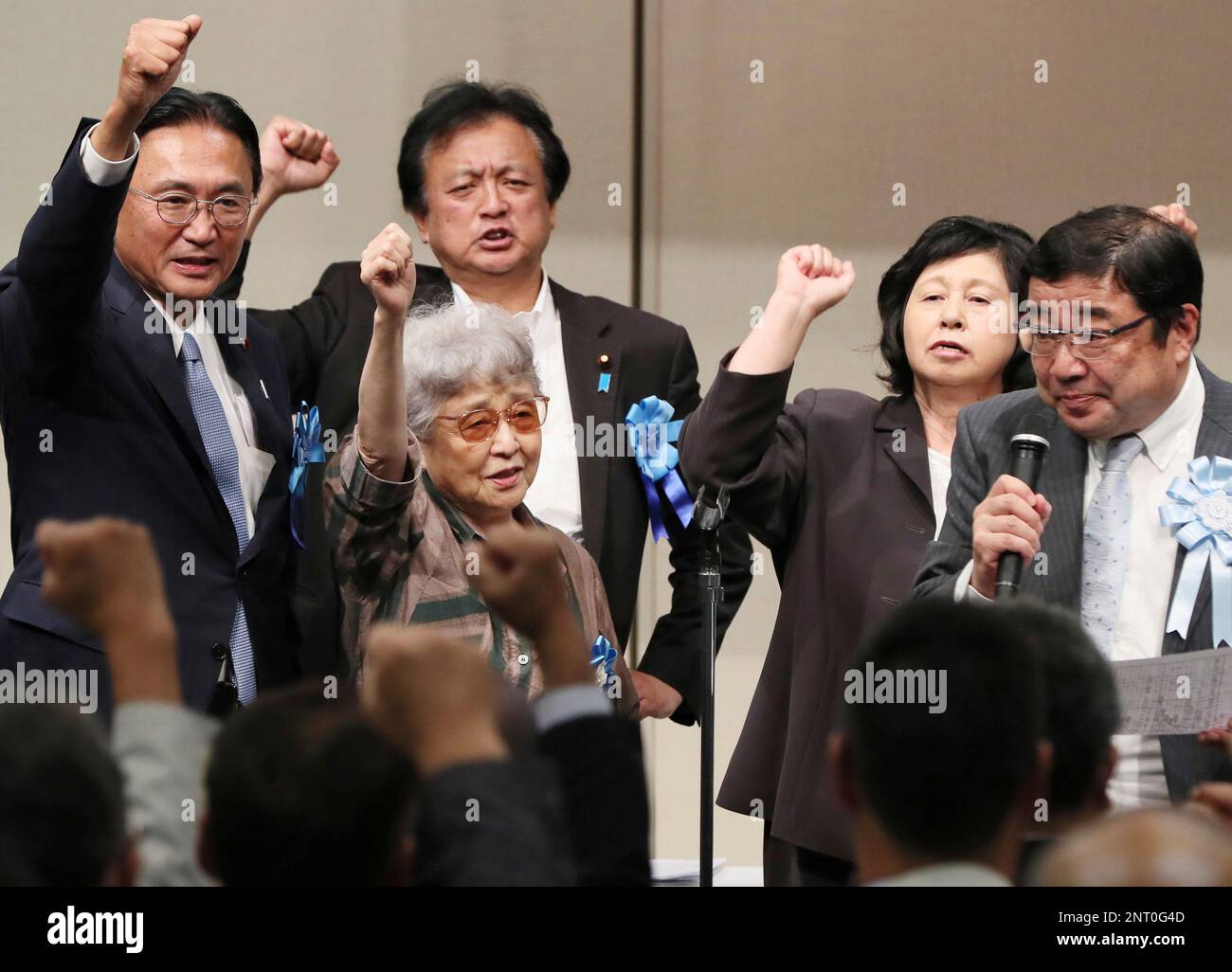 Sakie Yokota (center L), the mother of Megumi who was kidnapped in 1977 at  the age of 13, Hitomi Soga (center R), a former Japanese abductee, and  others attend a national meeting