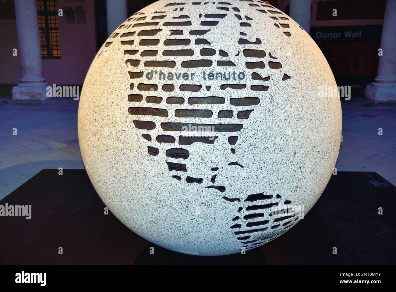 Padua, Italy. 27th February, 2023. A granite globe is the sculpture 'The abjuration of Galileo' by the conceptual artist Emilio Isgrò was inaugurated in the ancient courtyard of the University of Padua. Credit : Ferdinando Piezzi/Alamy Live News Stock Photo