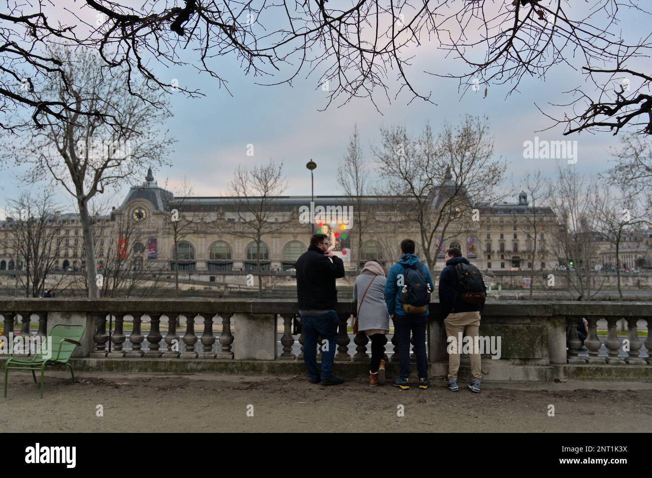 Group of friends looking towards the Orsay museum in the winter Stock Photo