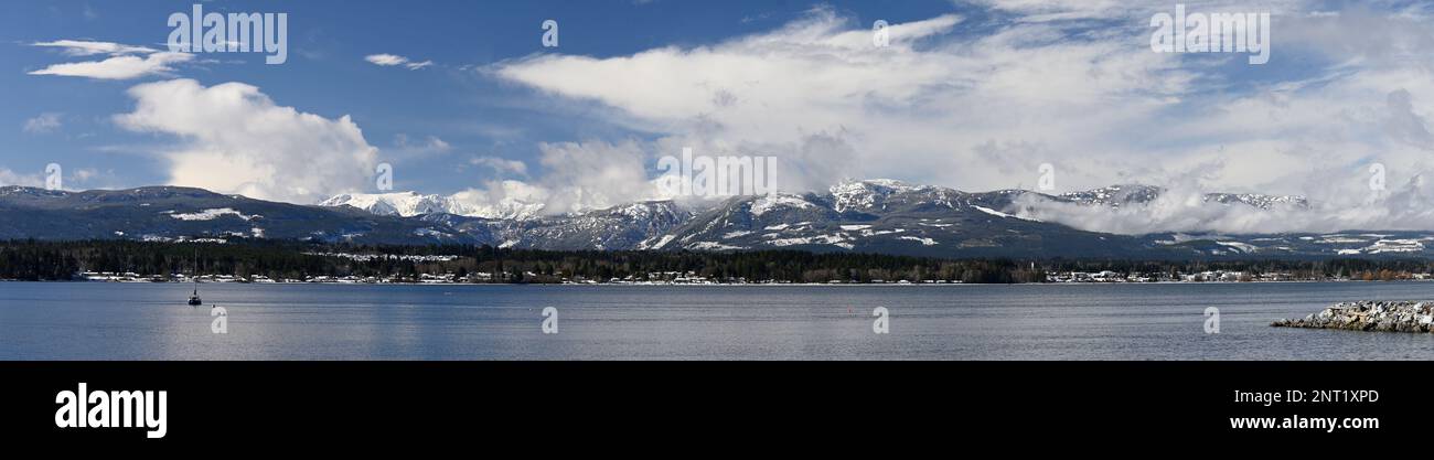 Panoramic view of the Courtenay Estuary and the Beaufort Mountains Stock Photo