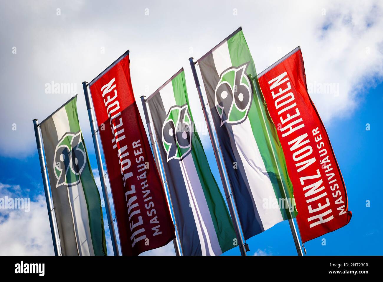 Hanover, Germany. 27th Feb, 2023. Flags with the Hannover 96 logo fly in front of the Heinz von Heiden Arena. Credit: Moritz Frankenberg/dpa/Alamy Live News Stock Photo