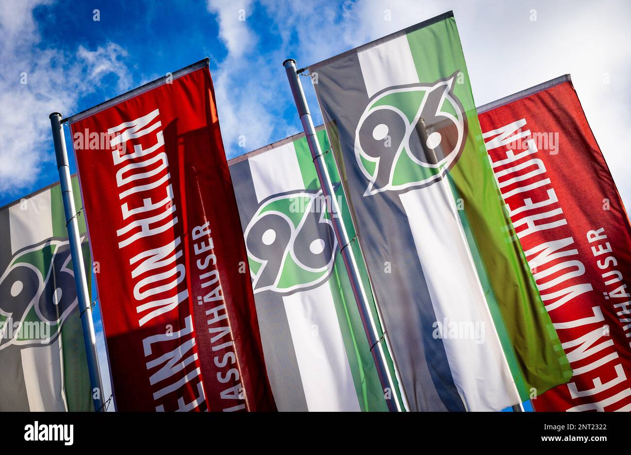 Hanover, Germany. 27th Feb, 2023. Flags with the Hannover 96 logo fly in front of the Heinz von Heiden Arena. Credit: Moritz Frankenberg/dpa/Alamy Live News Stock Photo