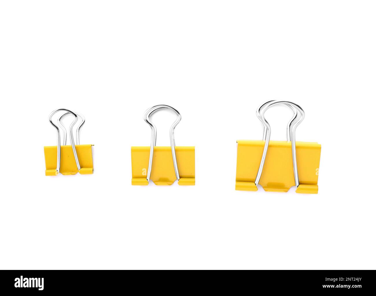 Yellow binder clips in white background Stock Photo Alamy