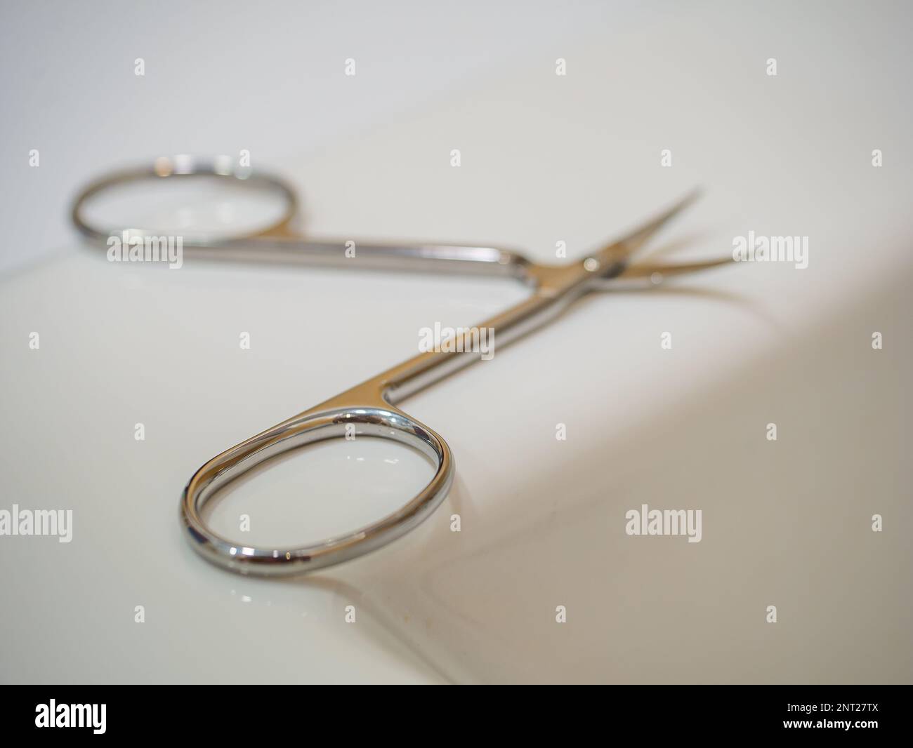 Manicure scissors for nails on a white background. Stock Photo