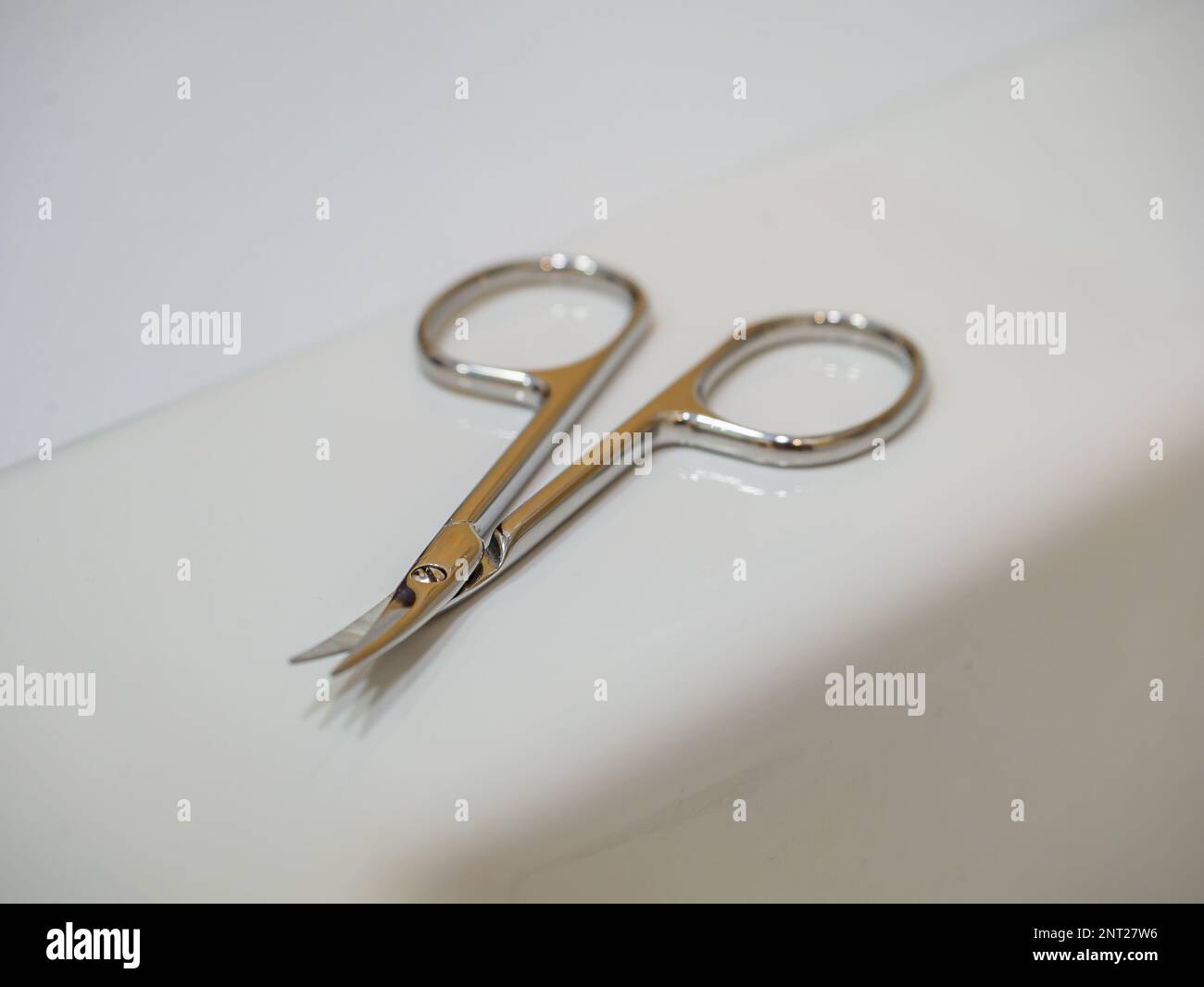 Manicure scissors for nails on a white background. Stock Photo