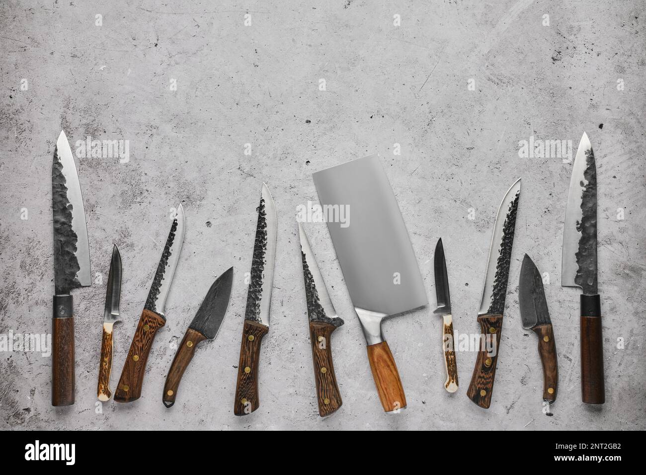 Different kinds of butcher's knives by blacksmith Stock Photo