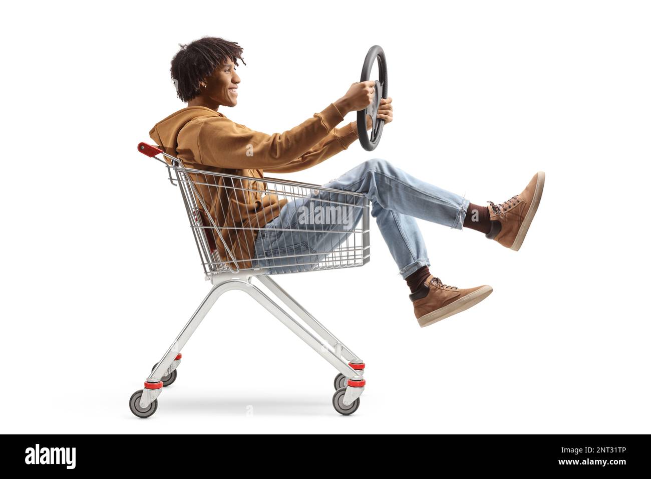African american guy inside a shopping cart holding a steering wheel