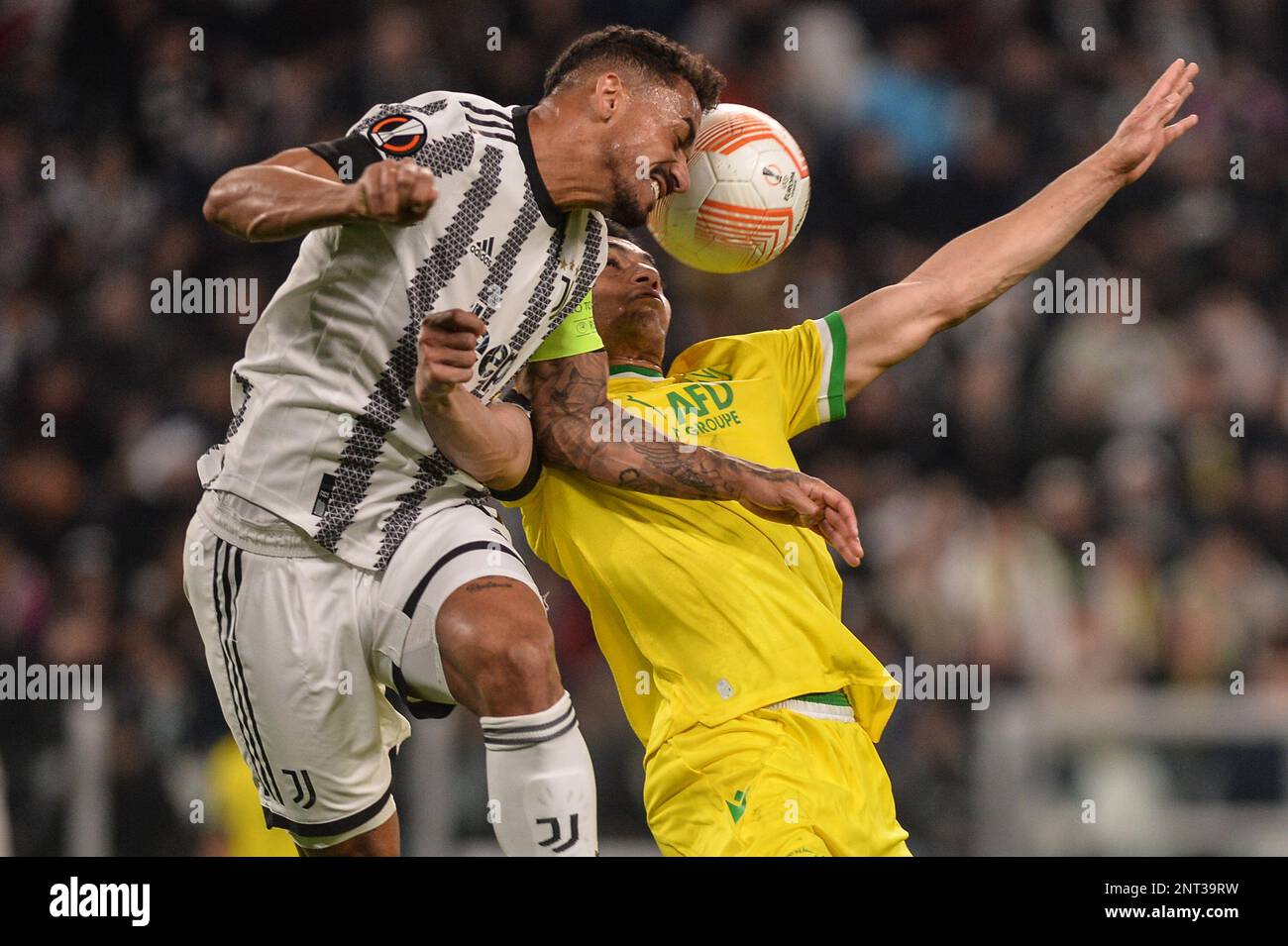 Bremer (Juventus), Mostafa Mohamed (Fc Nantes)during the UEFA Europa League knockout round play-off leg one match between Juventus and FC Nantes at Al Stock Photo - Alamy