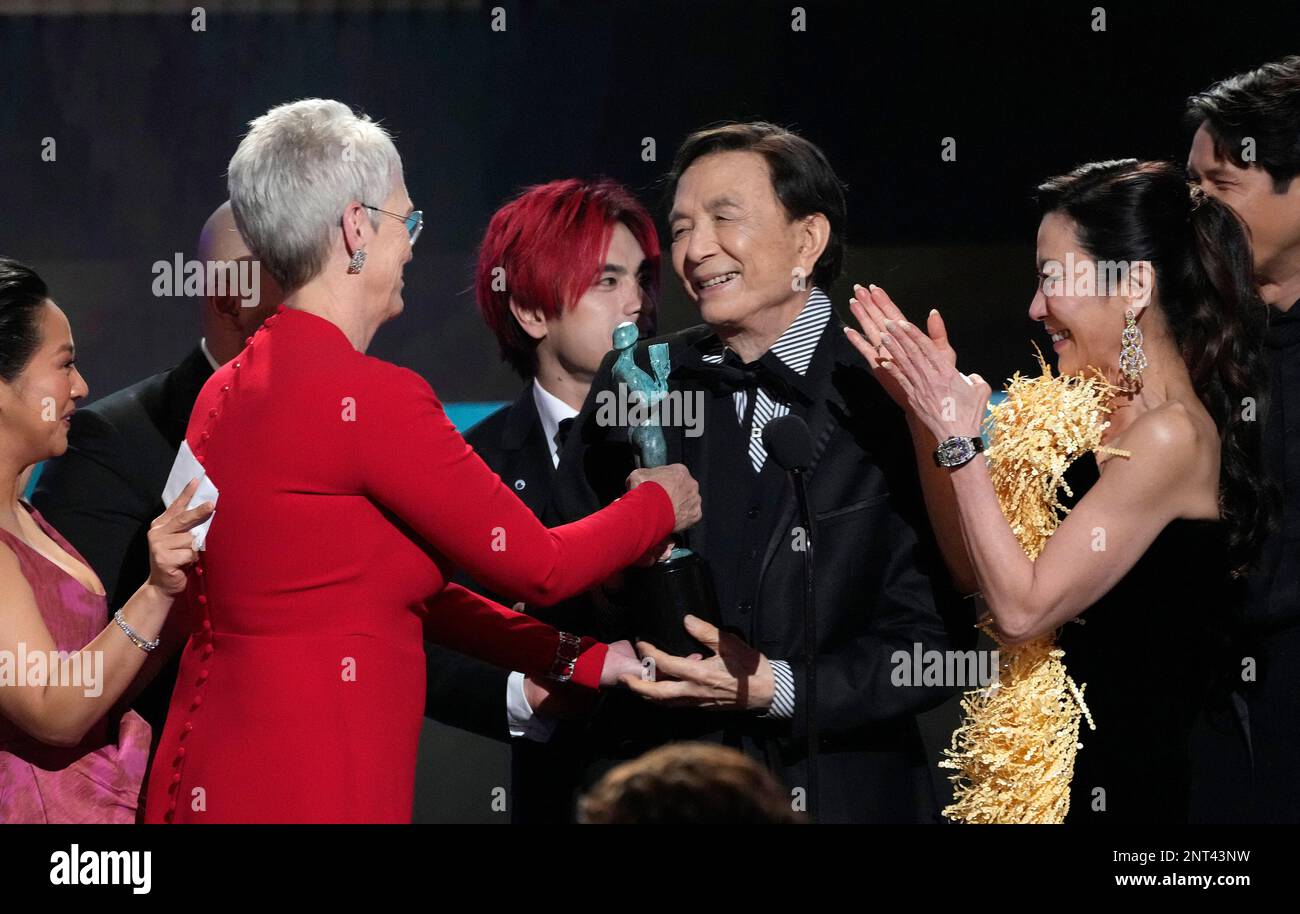 Jamie Lee Curtis, from left, James Hong, and Michelle Yeoh accept the