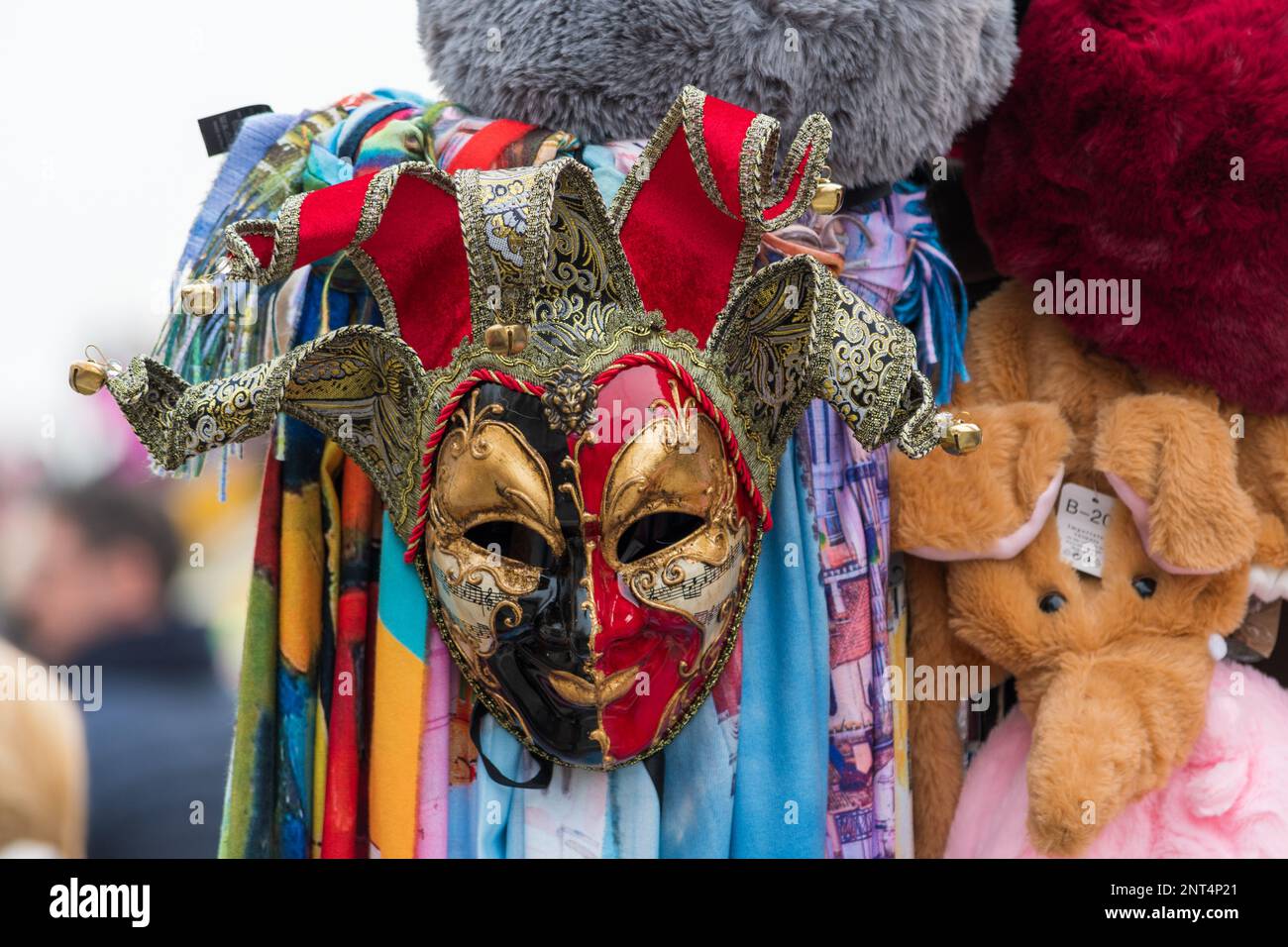 Mask hanging in a stand. Symbol of Carnival with bright colors. Stock Photo