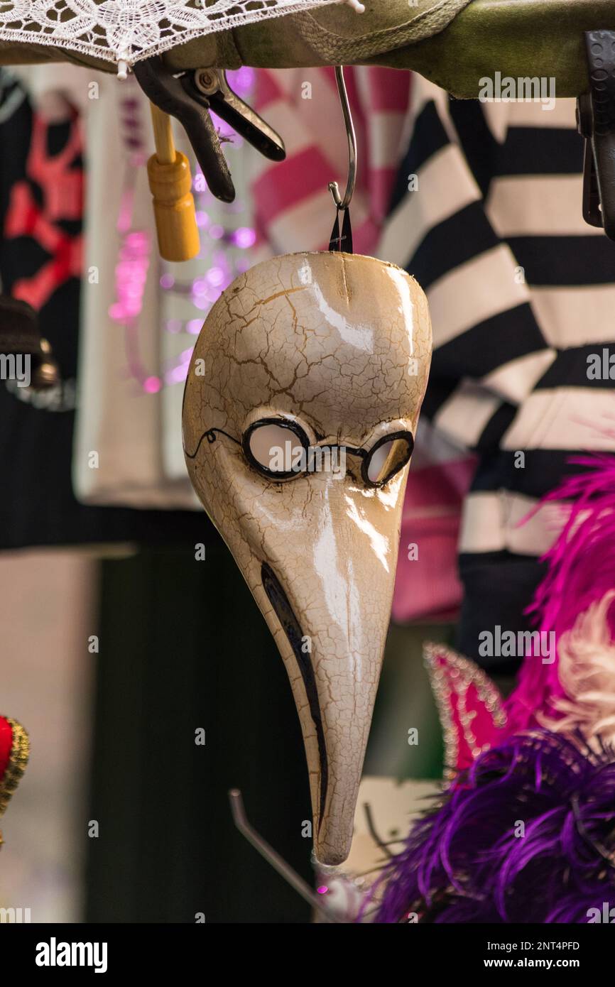 Mask hanging in a stand. Symbol of Carnival with bright colors. Stock Photo