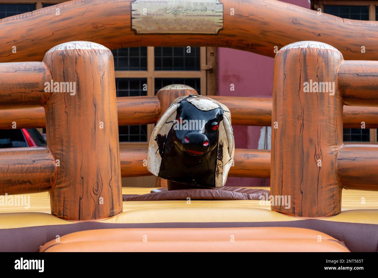 Large rodeo mechanical Bull Riding machine made from wood. Stock Photo