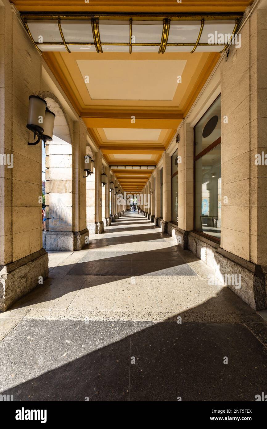 Wroclaw, Poland - May 2022: Sun Light and shadows in tunnel of Arkady Wroclawskie Stock Photo