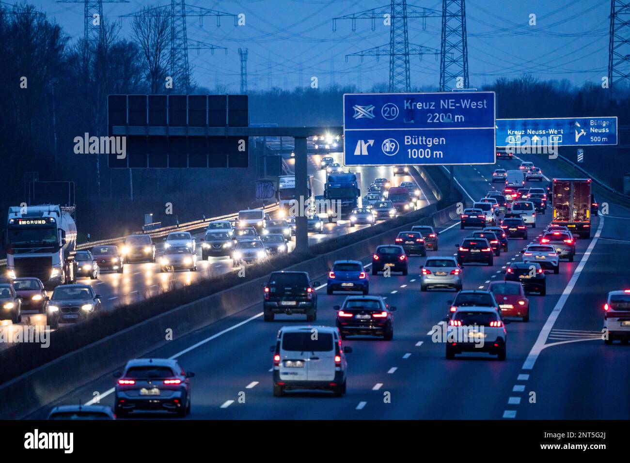 Motorway A57 near Kaarst in the Rhine district of Neuss, view in the  direction of the Büttgen junction, heavy off-peak traffic, overhead power  line ro Stock Photo - Alamy