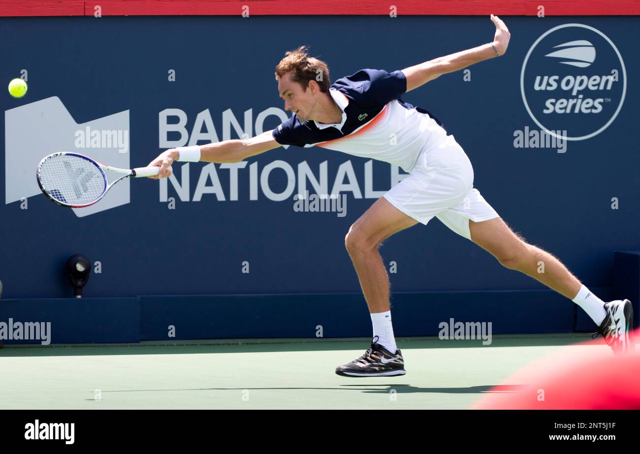 Daniil Medvedev, of Russia, reaches out for the ball in his match against  Dominic Thiem, of Austria, during quarterfinal play at the Rogers Cup  tennis tournament in Montreal, Friday, Aug. 9, 2019. (